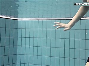Loris blackhaired teen swirling in the pool